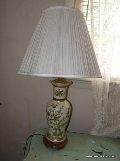 (BED) ORIENTAL STYLE LAMP; IVORY COLORED WITH MUTED GREEN AND GOLD PAINTED FLORAL DESIGN. SITS ATOP