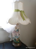 (BED) PORCELAIN VICTORIAN STATUE LAMP WITH LAMPSHADE; YOUNG MAIDEN IN PASTEL SHADES STANDING ON A