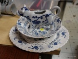 (KIT) ENGLISH IRONSTONE LOT; WHITE WITH BLUE PATTERNS. 4 SAUCERS, ONE SERVING DISH, AND 1 OVAL