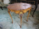 (BED) FRENCH PROVINCIAL SIDE TABLE; 4 CABRIOLE LEGS WITH ROSE DESIGN CARVED INTO THE CORNERS. OVAL