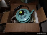 (GAR) TABLE LOT; INCLUDES VINTAGE LAMP IN BOX, A SMALL METAL TEAL BLUE TEAPOT WITH LID, BOX OF