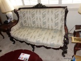 (LR) ELEGANT VICTORIAN SETTEE; BEAUTIFUL RICH WOOD FRAME WITH ANGELS AND FLOWERS CARVED INTO THE