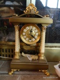 (LR) DECORATIVE GOLD TONE MANTLE CLOCK; FEATURES GOLD TONE ORNATE DETAILED FEET, AND COLUMNS, MADE