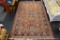 RED HAND-KNOTTED AREA RUG