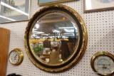 ROUND GOLD AND BLUE FRAMED MIRROR