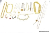 GOLD (COLOR) LOT! BAG LOT THAT INCLUDES A LARGE AMOUNT OF GOLD TONED NECKLACES AND PENDANTS.