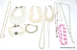 BAG LOT OF PEARL NECKLACES. INCLUDES A PINK BEADED AND PEARL STYLE NECKLACE AND ALSO A IRIDESCENT