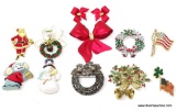 HOLIDAY BROOCH LOT!! INCLUDES A SNOWMAN, SANTA, AND WREATH BROOCHES, A LARGE RED BOW BROOCH WITH