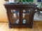 (LR)MODERN CHERRY CONSOLE CURIO CABINET- COLUMNED FRONT- 2 BEVELED GLASS DOORS-2 GLASS SIDE