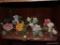 (BASE-STAIR-RM) SHELF LOT OF FLOWER FIGURINES- TOTAL-7