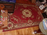 (DEN) MACHINE MADE ORIENTAL STYLE RUG IN RED AND IVORY- 63