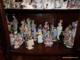 (LR) SHELF LOT OF FIGURINES- TALLEST- 9