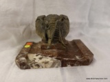 (DIS)ELEPHANT HEAD ON MARBLE PEDESTAL