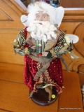COLLECTIBLE SANTA FIGURE ON WOOD STAND