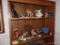 (DEN) 2 SHELF LOT- OF MISC.. ITEMS TO INCLUDE WOOD CARVED TOTEM POLE, MINIATURE BOWL AND PITCHER