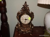 (LEFT BED) VINTAGE GOLD PAINTED METAL ELECTRIC CLOCK- 11