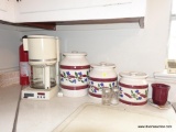 (KIT) CONTENTS ON TOP OF COUNTER- INCLUDE- CUISINART COFFEE MAKER- 3 PC CANISTER SET, GLASS TOP