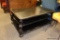 LARGE BLACK PLATFORM COCKTAIL TABLE