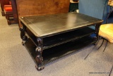 LARGE BLACK PLATFORM COCKTAIL TABLE