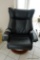 (TV) RECLINING ARM CHAIR; BLACK ARTIFICIAL LEATHER RECLINING ARMCHAIR WITH WOODEN BASE: 33 IN X 30