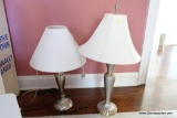 (PINK) 2 LAMPS; LOT OF 2 LAMPS. BOTH ARE SILVER TONED AND HAVE SHADES. 1 HAS A FINIAL: 33 IN TALL. 1