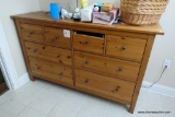 (BA2) DRESSER; PINE 8 DRAWER DRESSER: 64 IN X 20 IN X 38 IN. 1 DRAWER HAS SOME DAMAGE BUT CAN BE