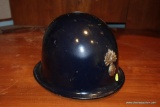 (BO) FRENCH HELMET; FRENCH POLICE SURPLUS HELMET WITH METAL BADGE AND INNER LINER. POSSIBLY FROM THE