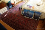 (BBR) SAROUK PALACE RUG; LARGE HAND KNOTTED PERSIAN RUG IN SHADES OF RED, TAN, NAVY BLUE, AND BLACK.