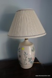 (BBR2) HAND PAINTED TABLE LAMP WITH FLORAL DESIGN AND PLEATED SHADE; STANDS ABOUT 21 IN TALL.