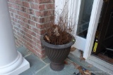 (OUT) PAIR OF PLASTIC STONE-LOOK PLANTERS; LOCATED ON FRONT PORCH AT DOOR. ROUND, EACH STANDS ABOUT