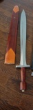 (MBR) VINTAGE SWORD IN SCABBARD; MADE IN INDIA, SOLID REDDISH WOOD HANDLE. MEASURES 30 IN LONG.