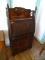 (DOWN BED) UNUSUAL ANTIQUE OAK ARTS AND CRAFTS DROP FRONT GALLERIED TOP DESK- APPLIED CARVED SIDES,