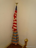 (BED 2)AMERICAN FLAG ON POLE AND A BEACH UMBRELLA
