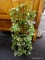 DECORATIVE GRAPEVINE CHAIR COVERED IN IVORY; FRAME OF CHAIR IS BROWN WITH GREEN IVY DRAPED