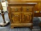 HEYWOOD WAKEFIELD NIGHTSTAND; SINGLE PANELED FRONT DRAWER OVER DOUBLE DOOR CABINET AND BRACKET FEET.