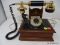 VINTAGE STYLE ROTARY TELEPHONE; WOODGRAIN, BLACK, AND BRASS-TONE COLORS. MADE BY DECO-TEL OF EL