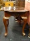 MAHOGANY END TABLE (1 OF A PAIR); HAS QUEEN ANNE FEET AND BANDED TURTLE SHELL SHAPED TOP. MEASURES