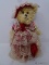 (DIS) VICTORIAN TEDDY BEAR FIGURINE; PLUSH TAN BEAR DRESSED IN VICTORIAN FINERY MADE OF RED SATIN