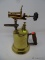 (DIS) VINTAGE BLOWTORCH; MADE OF BRASS AND HAS A WOODEN HANDLE. GREAT FOR PRACTICAL USE OR AS A