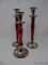 (DIS) RED CANDLESTICK SET; 3 RED PAINTED CANDLESTICK HOLDERS. 2 ARE 12 IN TALL AND 1 IS 10 IN TALL