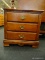 3 DRAWER NIGHTSTAND; WITH DENTIL MOLDED TRIM, BRASS CUTOUT BATWING STYLE PULLS, DOVETAILED DRAWERS,