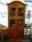 GLASS FRONT WOODEN CUPBOARD; BONNET TOP WITH CROWN MOLDING OVER DOUBLE GLASS FRONT DOORS. 2