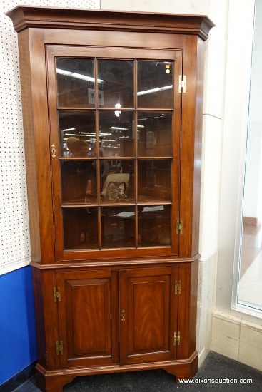 HENKEL HARRIS CORNER CABINET; ELEGANTLY CONSTRUCTED AND GORGEOUS WILD BLACK CHERRY MAKES THIS PIECE