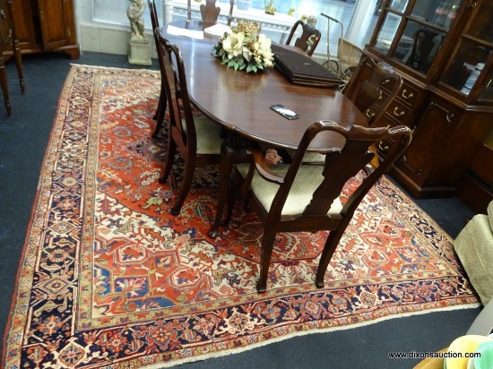 HERIZ AREA RUG; BEAUTIFUL GEOMETRIC PATTERN AND BORDER IN SHADES OF RED, TAN, BLACK, AND BLUE. MADE