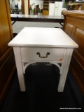 LANE WHITE WOODEN END TABLE; SINGLE DRAWER, DECORATIVE CORNER BRACES, AND SQUARE LEGS. MEASURES 22