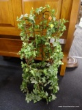 DECORATIVE GRAPEVINE CHAIR COVERED IN IVORY; FRAME OF CHAIR IS BROWN WITH GREEN IVY DRAPED