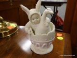 ORIGINAL SNOWBABIES FIGURINE; MADE BY DEPT 56, A BABY IN A BUNNY SUIT HOLDING A GOOSE AND SEATED IN