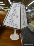 WHITE BEDSIDE TABLE LAMP; FLORAL 6 PANEL LAMPSHADE ON A MOLDED WHITE BASE. STANDS 21 IN TALL.