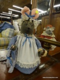 PLUSH WEIGHTED GRANDMA MOUSE; MAKES GREAT DECOR OR DOORSTOP. GREY IN COLOR WITH A LIGHT BLUE COLORED