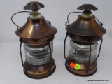 LANTERN DECANTERS; PAIR OF DECANTERS IN THE FORM OF LANTERNS. WEATHERED COPPER COLOR WITH CLEAR